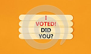 I voted. Did you symbol. Concept words I voted. Did you on wooden stick. Beautiful orange table orange background. Business I