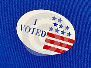`I voted` sticker on blue fabric