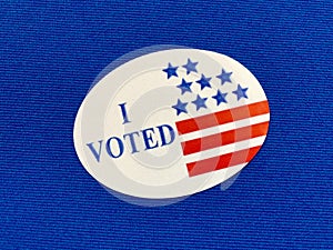 `I voted` sticker on blue fabric