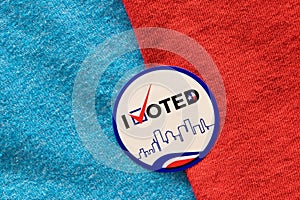 I Voted sticker split between red and blue materials indicating both Democrat and Republican party.