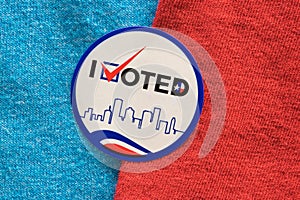 I Voted sticker split between red and blue materials indicating both Democrat and Republican party.