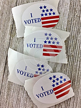 `I voted` stickers on wood surface