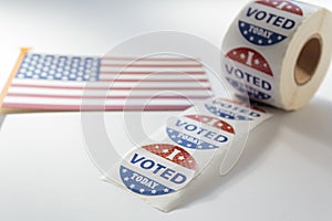 I Voted Today stickers and USA flag on white background. US presidential election concept