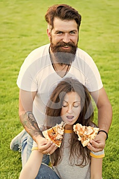 I want them all. summer picnic on green grass. Diet. happy couple eating pizza. Healthy food. fast food. bearded man