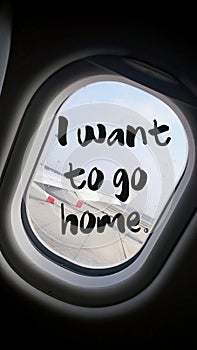 I want to go home quote with beautiful view of wing of plane on flight