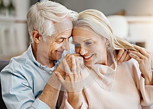 I only want to spend my life with you. a happy mature couple relaxing on the sofa at home.