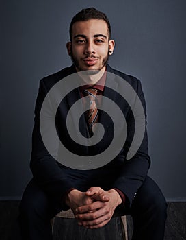 I was born for the corporate world. Studio portrait of a stylish young businessman against a gray background.