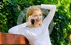 I was waiting your call. Girl blonde smiling face talk smartphone green nature background. Woman having pleasant