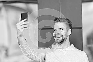 I was waiting for your call, Man beard with smartphone, urban background. Communication concept. Guy cheerful video