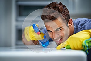 After this I will be able to see my reflection. a young man doing household chores.