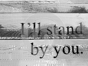 I will stand by you tip print on wood wall