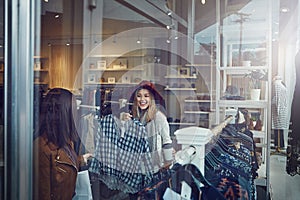 I would so rock this. two best friends out shopping in a clothing store.