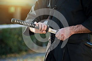 Iaido instructor draws his sword katana