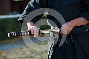 Iaido instructor draws his sword katana