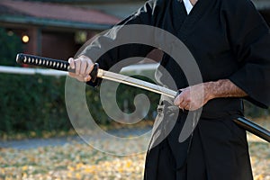 Iaido instructor draws his sword katana