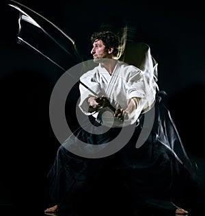 Iaido Kenjutsu budoka man isolated black background