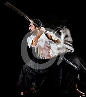 Iaido  Kenjutsu budoka man isolated black background