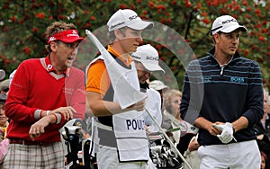 Ian Poulter talks to flight partner Henrik Stenson