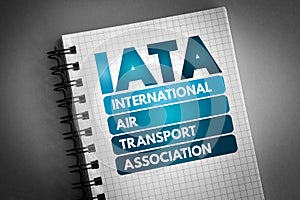 IATA - International Air Transport Association acronym on notepad, concept background