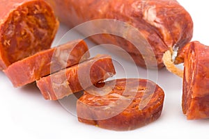 Iberian chorizo isolated on white photo