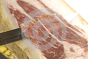 Iberian ham strips cut photo
