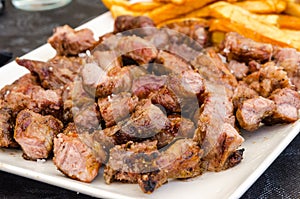 Iberian pork meat with fried potatoes