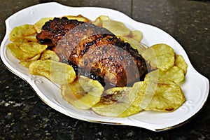 Iberian pork tenderloin on potato background