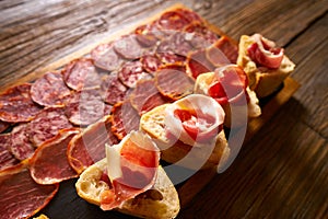 Iberian sausages ham board Tapas from spain photo