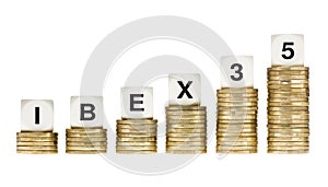 IBEX 35 (Madrid Stock Exchange Share Index) on Gold Coin Stacks Isolated on White