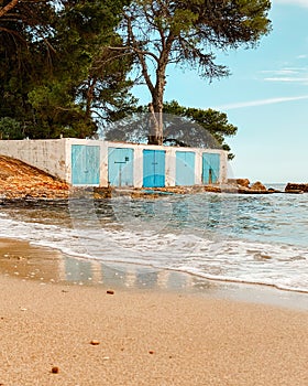 Ibiza beach and colorful fishermen's huts