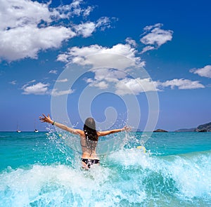 Ibiza beach girl splashing water in Balearics photo