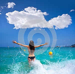 Ibiza beach girl splashing water in Balearics photo