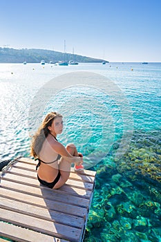 Ibiza bikini girl relaxed at Portinatx beach photo