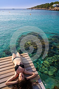 Ibiza bikini girl relaxed at Portinatx beach photo