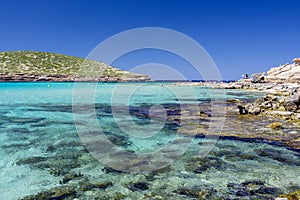 Ibiza - Cala Comte, view from Cala Escondida over the sea to the island Illa des Bosc