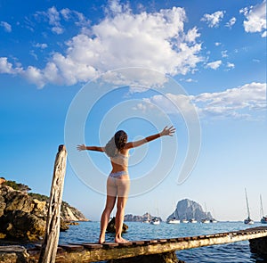 Ibiza cala d Hort girl pier sunset Es Vedra