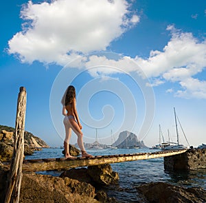 Ibiza cala d Hort girl pier sunset Es Vedra