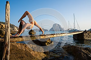 Ibiza cala d Hort girl pier sunset Es Vedra