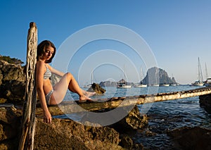 Ibiza cala d Hort girl pier sunset Es Vedra