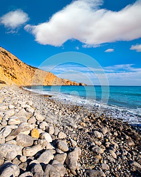 Ibiza Cala Jondal Beach with rolling stones in san Jose