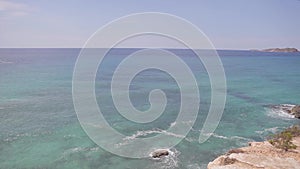 Ibiza cliffs, Horizontal panning and panoramic views of an ibiza beach in summer