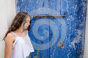 Ibiza Eivissa young girl on blue door photo