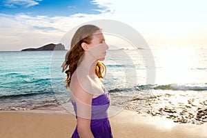 Ibiza girl at sunset in Cala Conta San Antonio photo