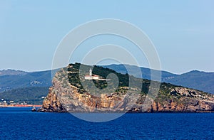 Ibiza lighthouse and sailboat view from the sea