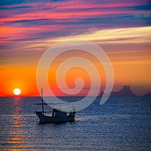 Ibiza sunset Es Vedra view and fisherboat formentera