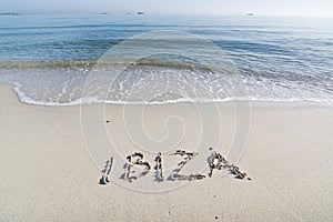 Ibiza written in sand