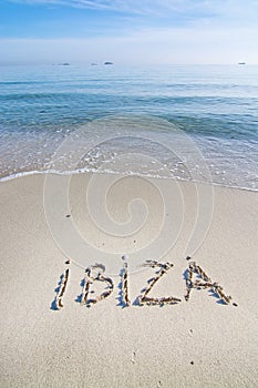 Ibiza written in sand