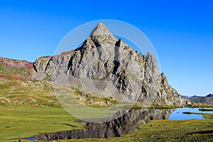 Ibon de Anayet with little water and with the bottom the Pico de Anayet. Concept famous mountains of the Pyrenees photo