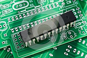 IC microchip or integrated circuit in DIP package on the printed circuit board photo