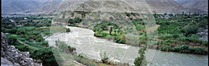panoramic viux of river and mountain with vineyard ica peru photo